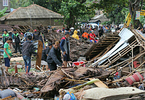 Residents inspect a house damaged by a tsunami, in Carita, Indonesia, Sunday, Dec. 23, 2018. The tsunami apparently caused by the eruption of an island volcano killed a number of people around Indonesia's Sunda Strait, sending a wall of water crashing some 65 feet (20 meters) inland and sweeping away hundreds of houses including hotels, the government and witnesses said. (AP Photo)